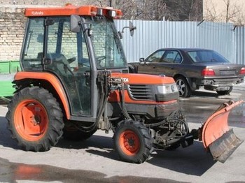 Kubota ST30 with brush and blade - Traktor